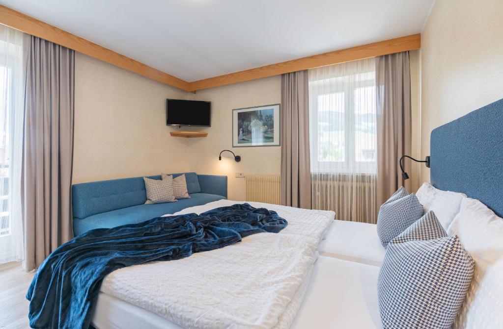 Postel nebo postele na pokoji v ubytování Hotel Nocker