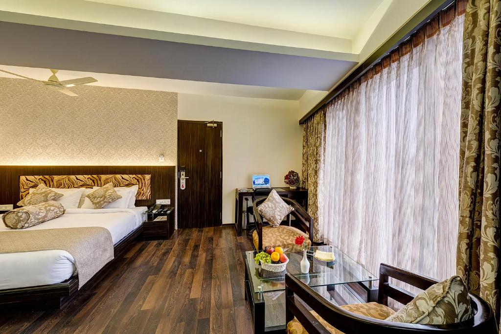 Postel nebo postele na pokoji v ubytování Viceroy Boutique Hotel
