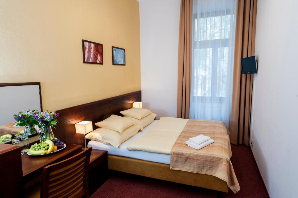Łóżko lub łóżka w pokoju w obiekcie Hotel Petr