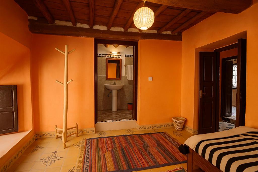 Postel nebo postele na pokoji v ubytování Atlas Kasbah Lodge