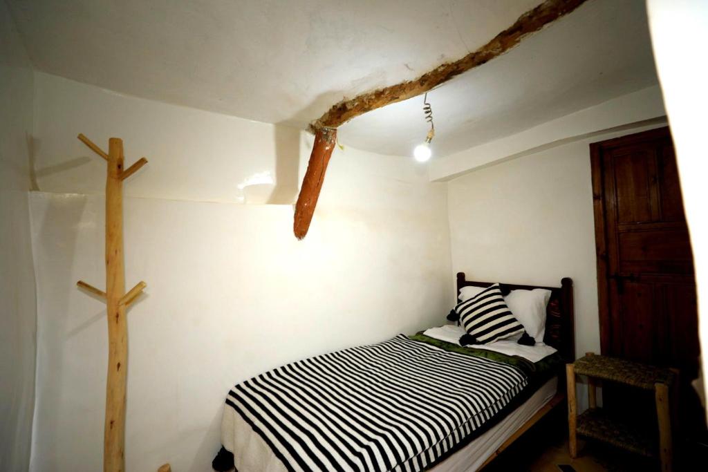 Postel nebo postele na pokoji v ubytování Atlas Kasbah Lodge