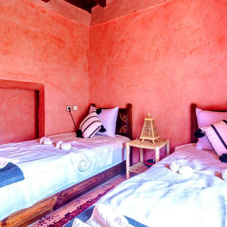 Postel nebo postele na pokoji v ubytování Atlas Kasbah Lodge