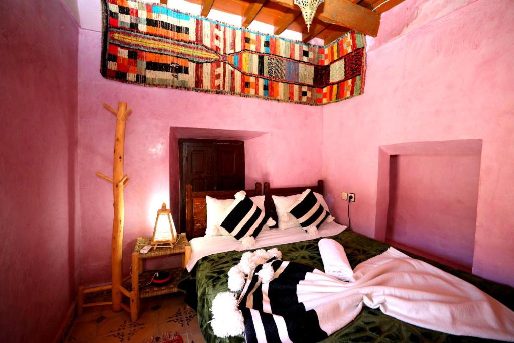 Postel nebo postele na pokoji v ubytování Atlas Kasbah Lodge