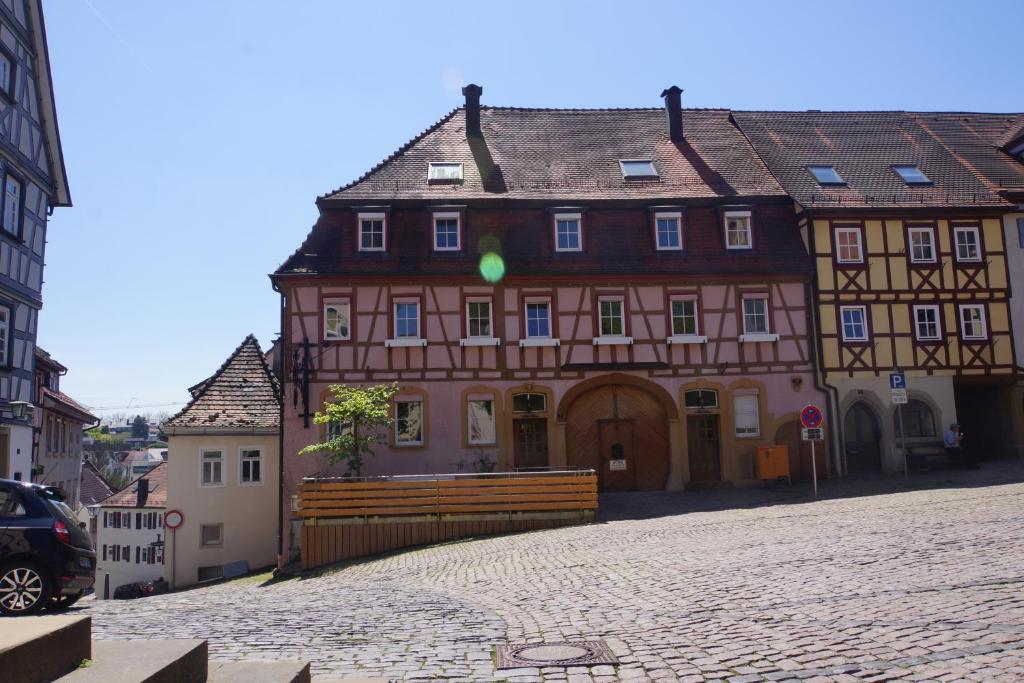 a large building in the middle of a street at Hotel Wagner Am Marktplatz in Bad Wimpfen