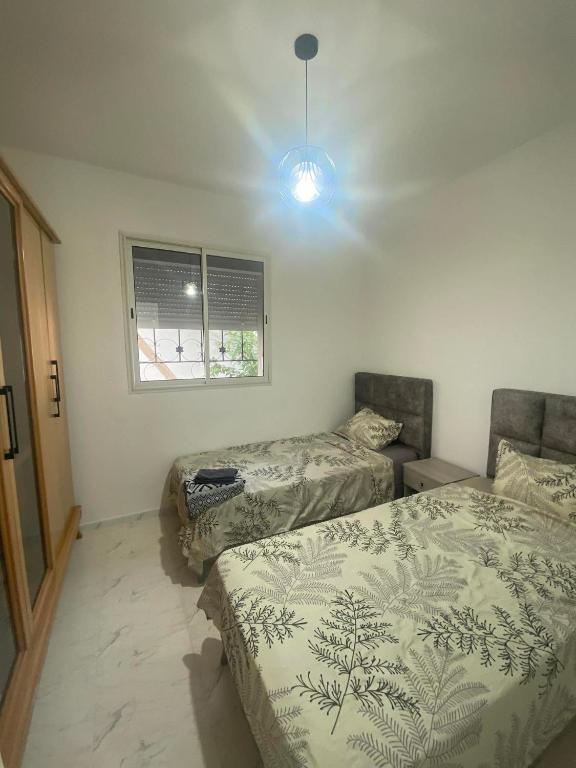 Postel nebo postele na pokoji v ubytování Appartement hannibal