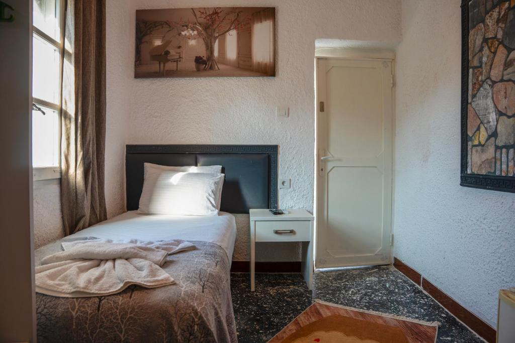 Postel nebo postele na pokoji v ubytování İMREN'S OTEL