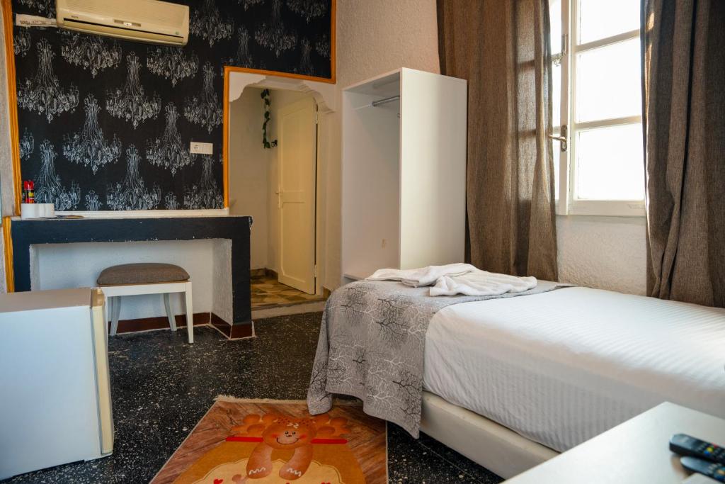 Postel nebo postele na pokoji v ubytování İMREN'S OTEL