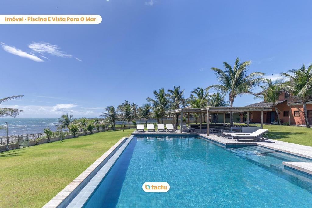 an image of a swimming pool at a resort at Casa da Praia, mansão à beira mar no Fortim in Maceio