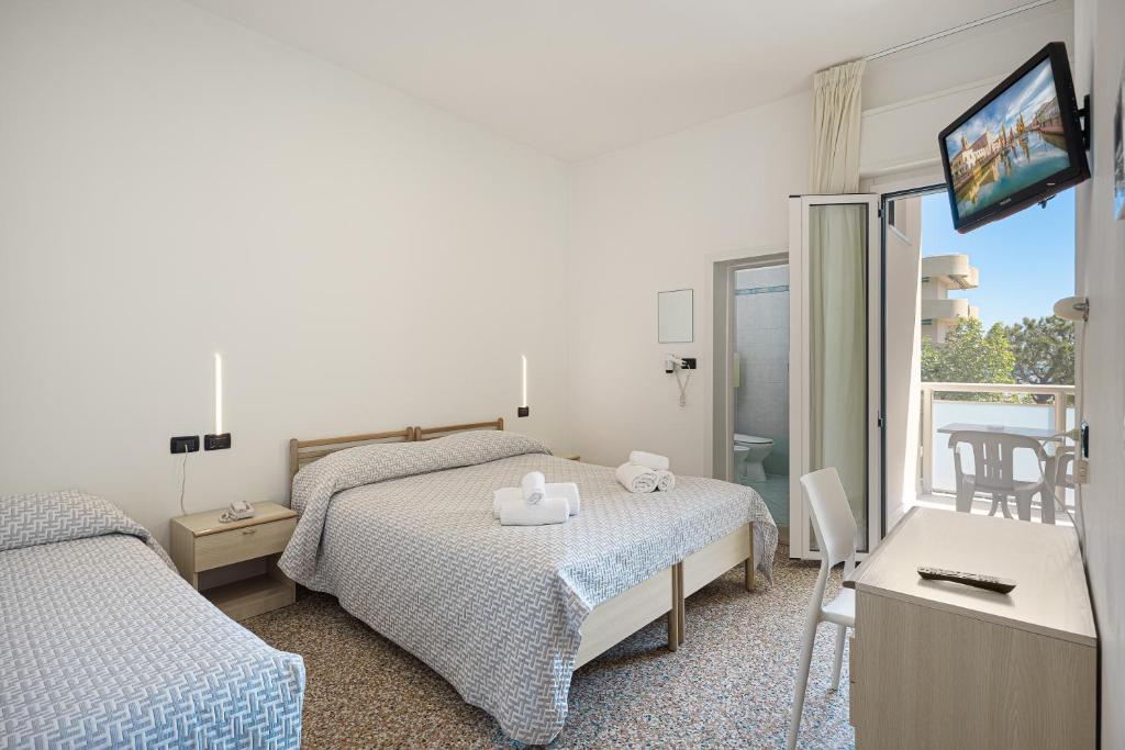 Postel nebo postele na pokoji v ubytování Hotel Altamarea Cesenatico