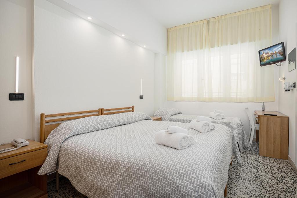 Postel nebo postele na pokoji v ubytování Hotel Altamarea Cesenatico