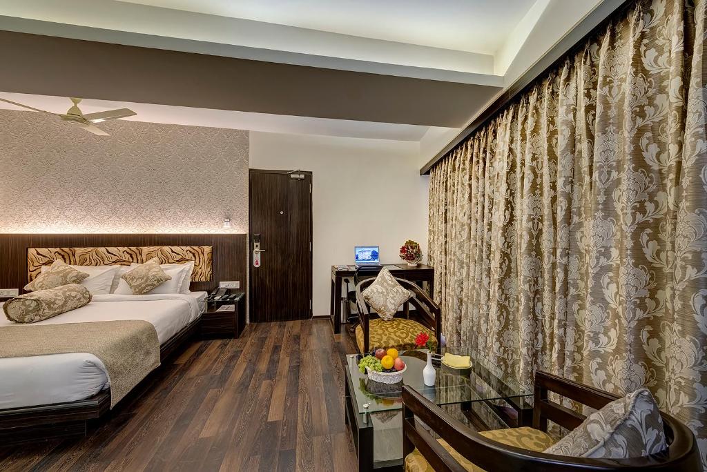 Postel nebo postele na pokoji v ubytování Viceroy Boutique Hotel