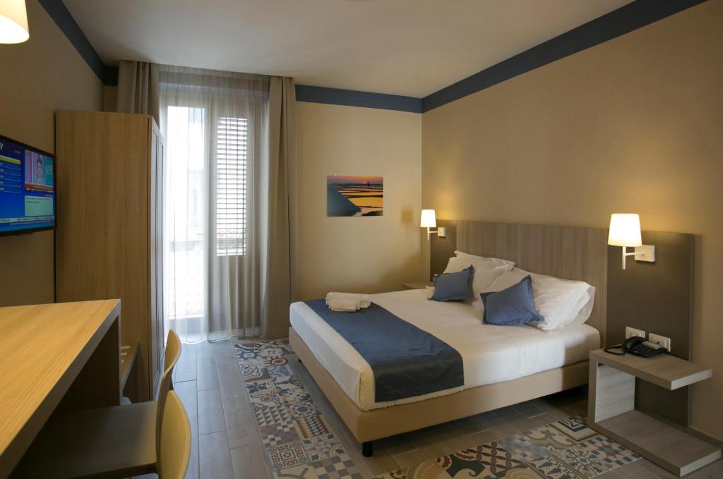 A bed or beds in a room at Map holiday residence