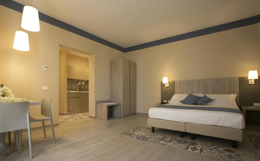 A bed or beds in a room at Map holiday residence