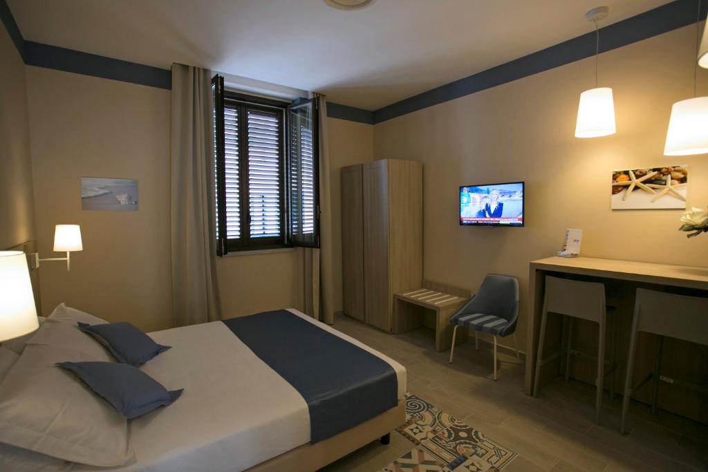 A bed or beds in a room at Map holiday residence