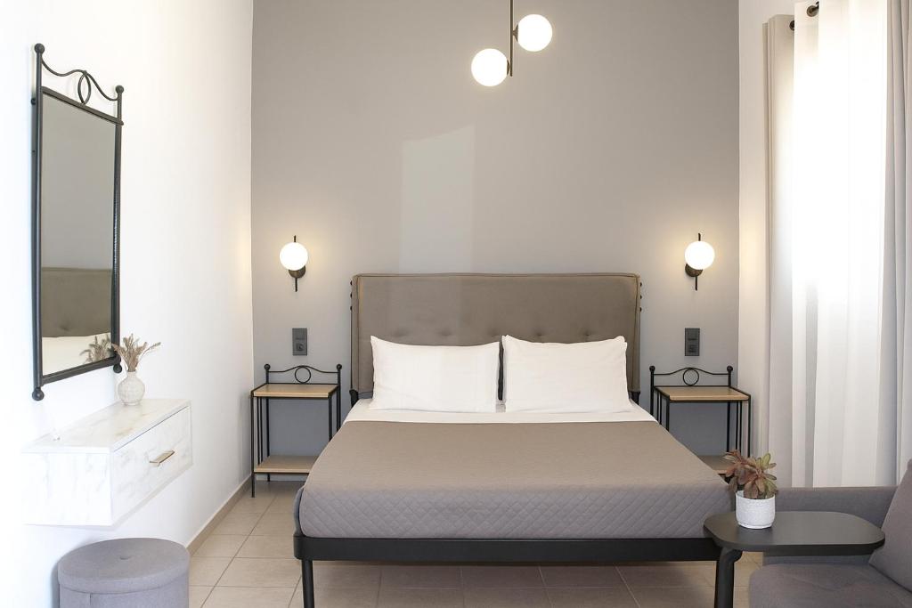 Postel nebo postele na pokoji v ubytování Fissas Rooms