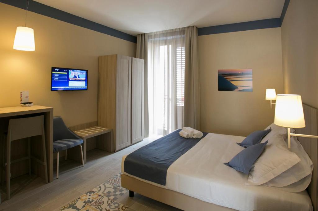 A bed or beds in a room at Map holiday residence