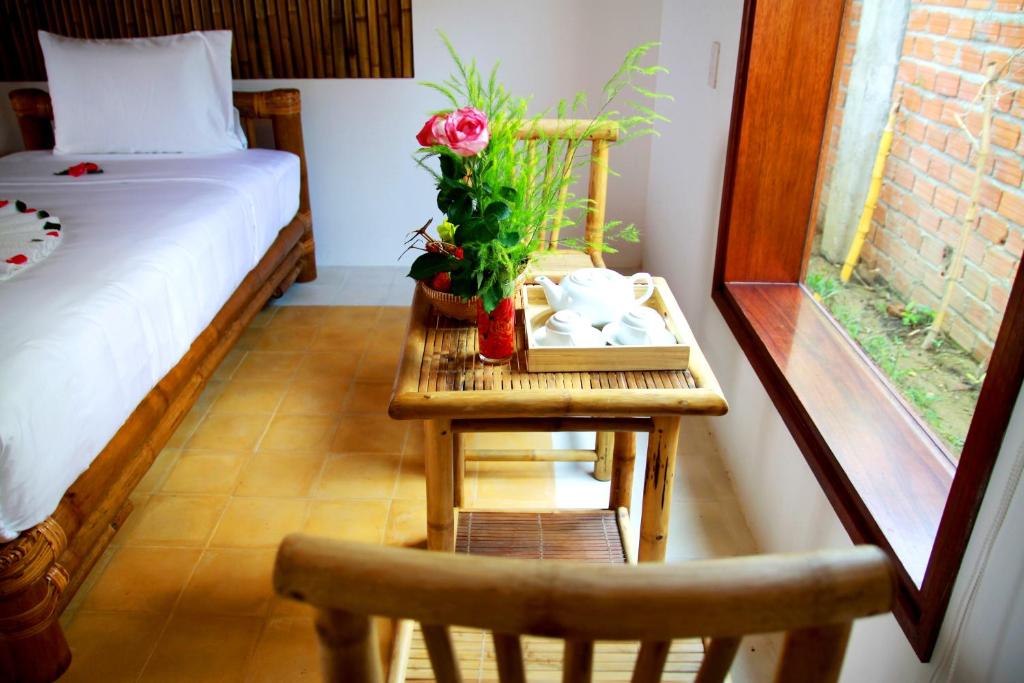 Postel nebo postele na pokoji v ubytování Hoi An Rustic Villa