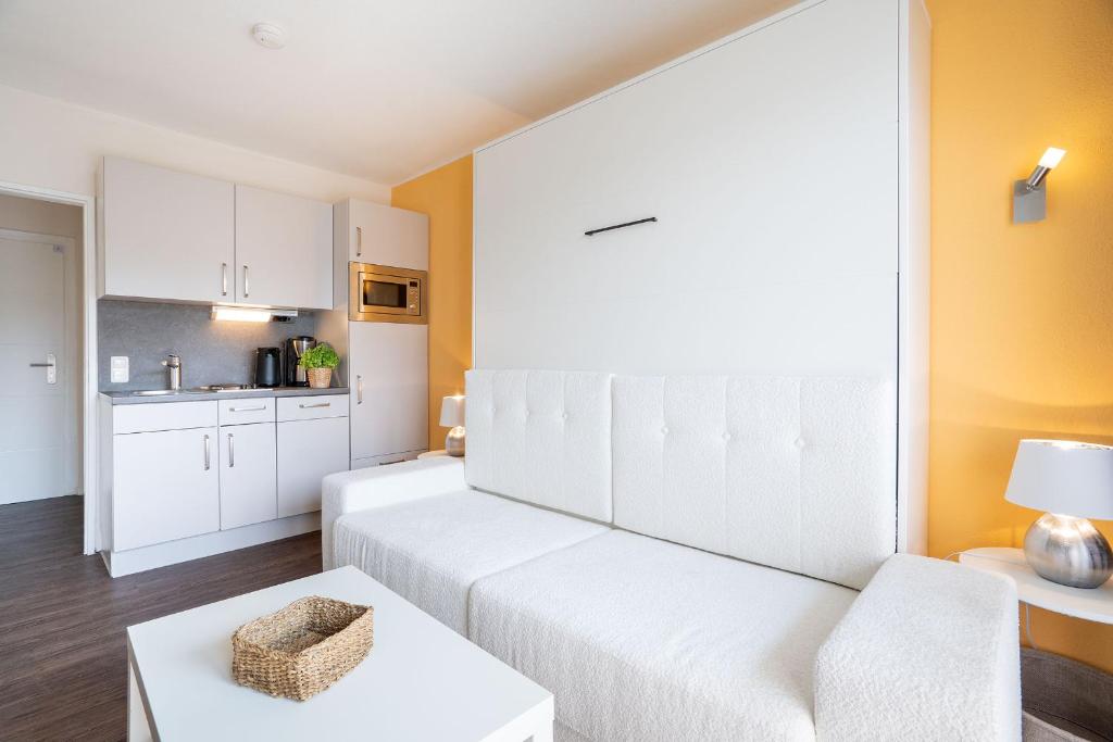 Kuchyň nebo kuchyňský kout v ubytování Das Solaris 18 Beach Apartment mit Gemeinschaftssauna und Grillplatz