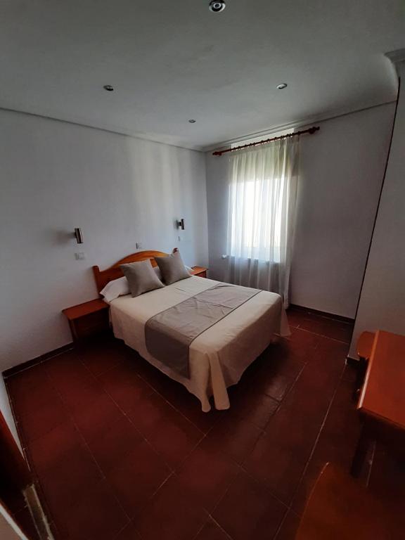 Postel nebo postele na pokoji v ubytování Hostal Bellas
