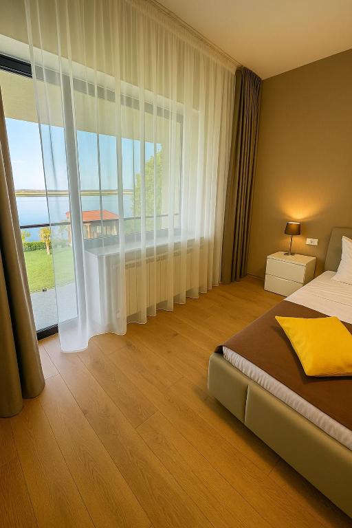 Postel nebo postele na pokoji v ubytování Casa Miralago Boutique ADULTS ONLY 12 Plus