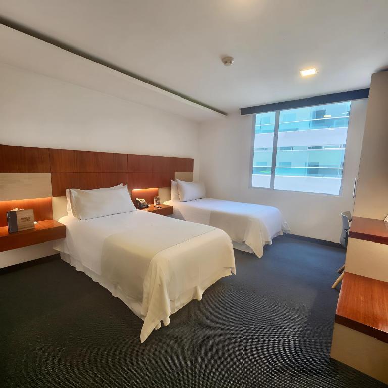 Postel nebo postele na pokoji v ubytování Hotel Finlandia