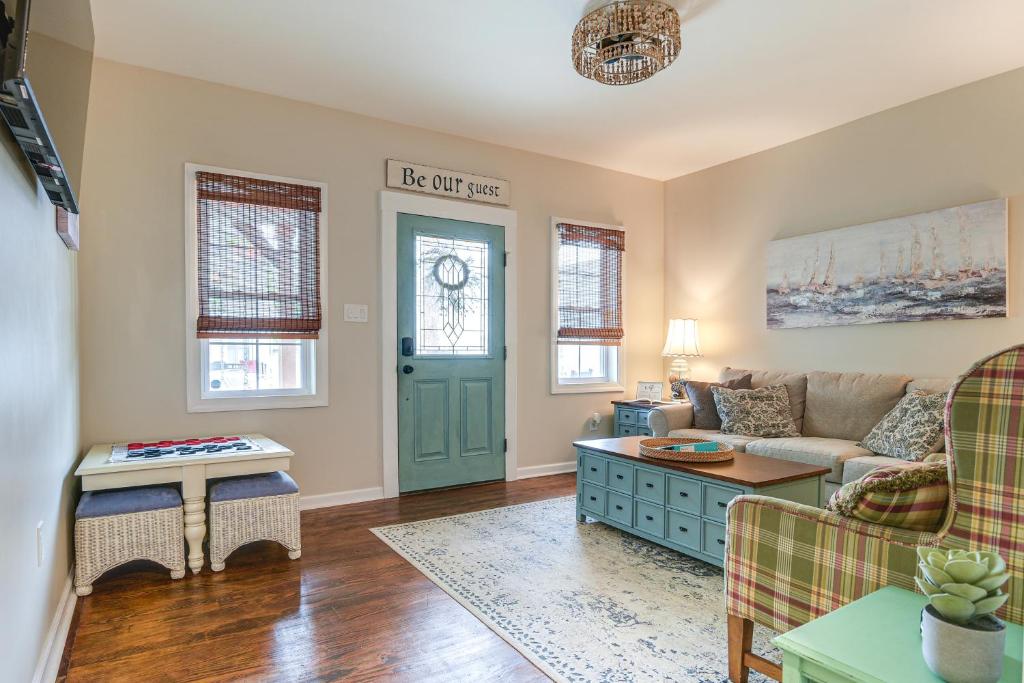 a living room with a couch and a table at Walk to Town and River Charming Home in North East! in North East