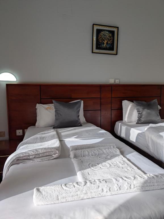 Postel nebo postele na pokoji v ubytování COFE Hotel Groupe