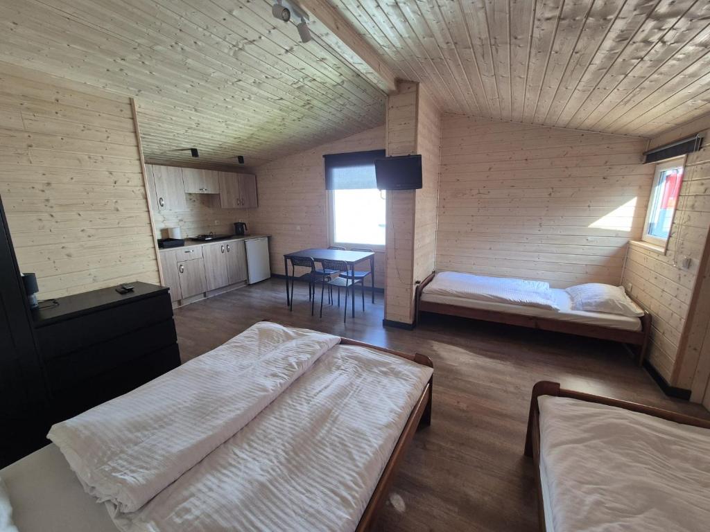 Posteľ alebo postele v izbe v ubytovaní Apartamenty Otylka
