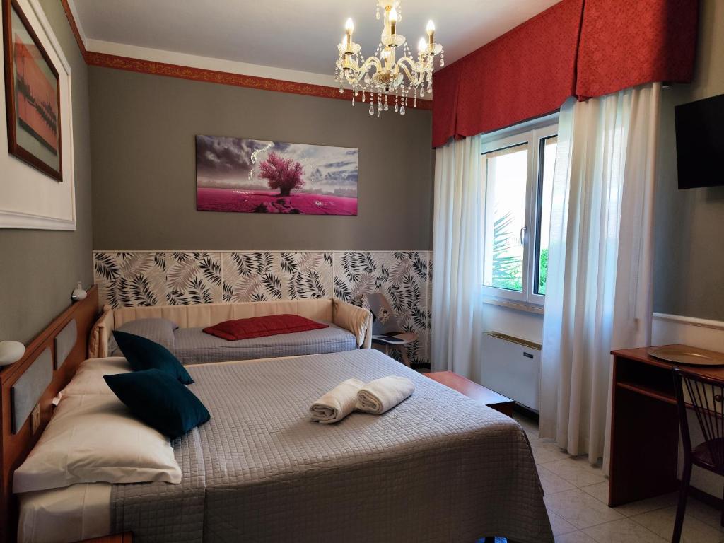 Кровать или кровати в номере Hotel Minerva