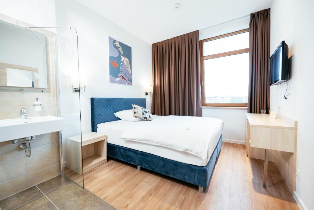 Postel nebo postele na pokoji v ubytování BO Hotel Hamburg