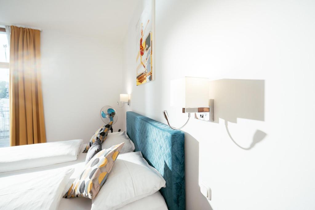 Postel nebo postele na pokoji v ubytování BO Hotel Hamburg