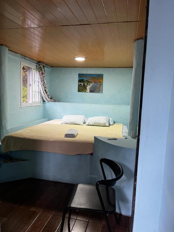 Una cama o camas en una habitación de Hotel Refugio Cariguana