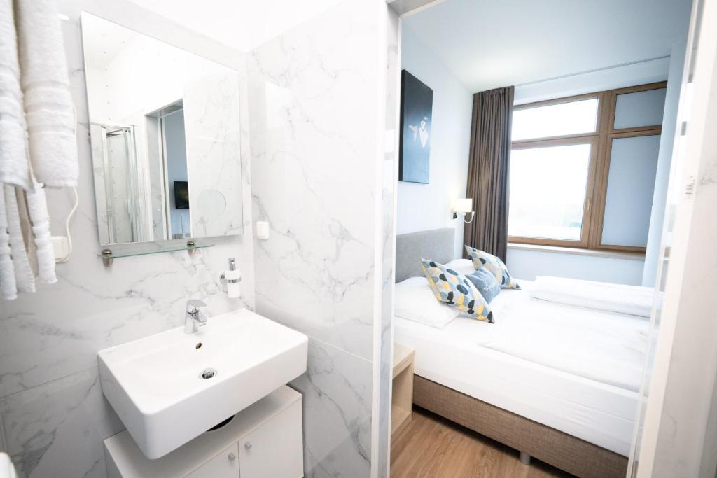 Postel nebo postele na pokoji v ubytování BO Hotel Hamburg