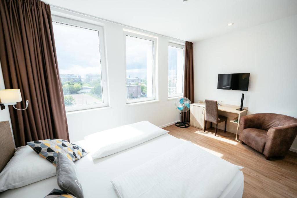 Postel nebo postele na pokoji v ubytování BO Hotel Hamburg