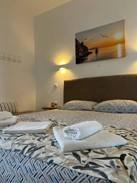 Postel nebo postele na pokoji v ubytování Yanna's Apartments