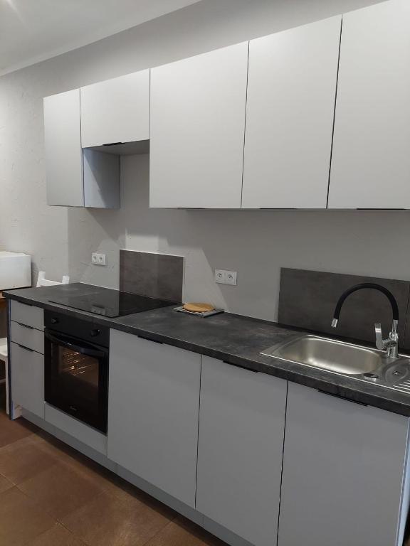 Kuchyňa alebo kuchynka v ubytovaní Apartamenty Otylka
