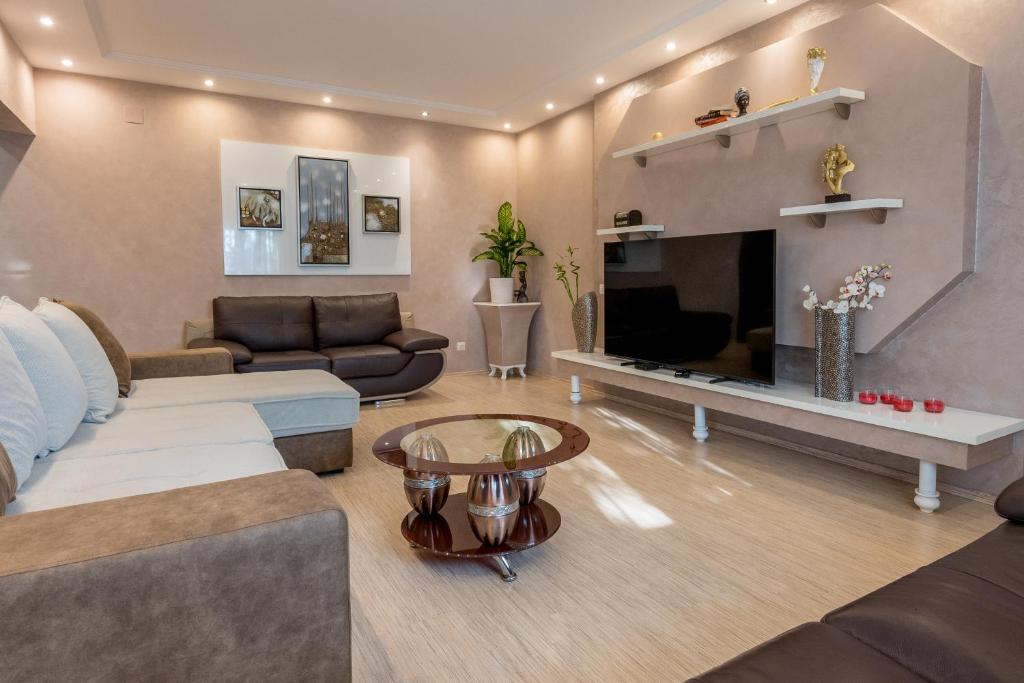 Posezení v ubytování Grande Apartments