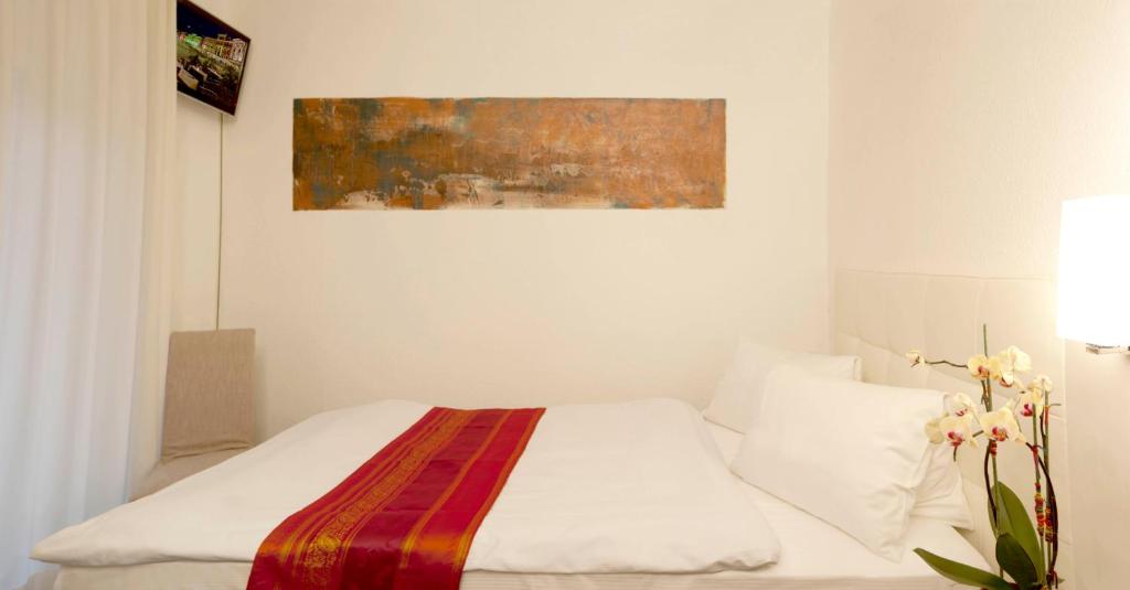 Postel nebo postele na pokoji v ubytování Hotel America