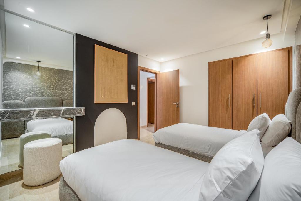 Postel nebo postele na pokoji v ubytování Kasbel 2 Appart & Pool