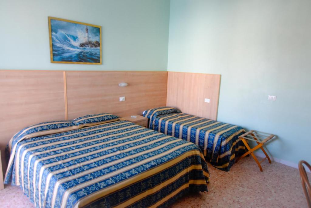 Postel nebo postele na pokoji v ubytování Hotel Bahamas