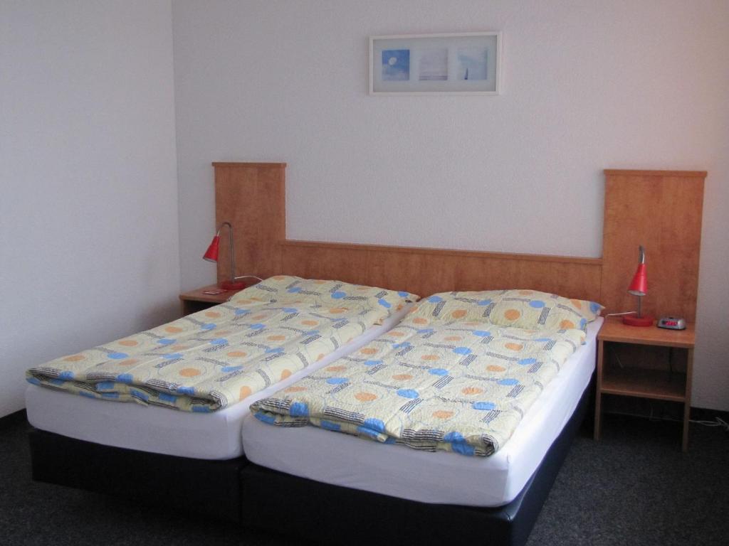 Postel nebo postele na pokoji v ubytování Budget Motel Self Check-In