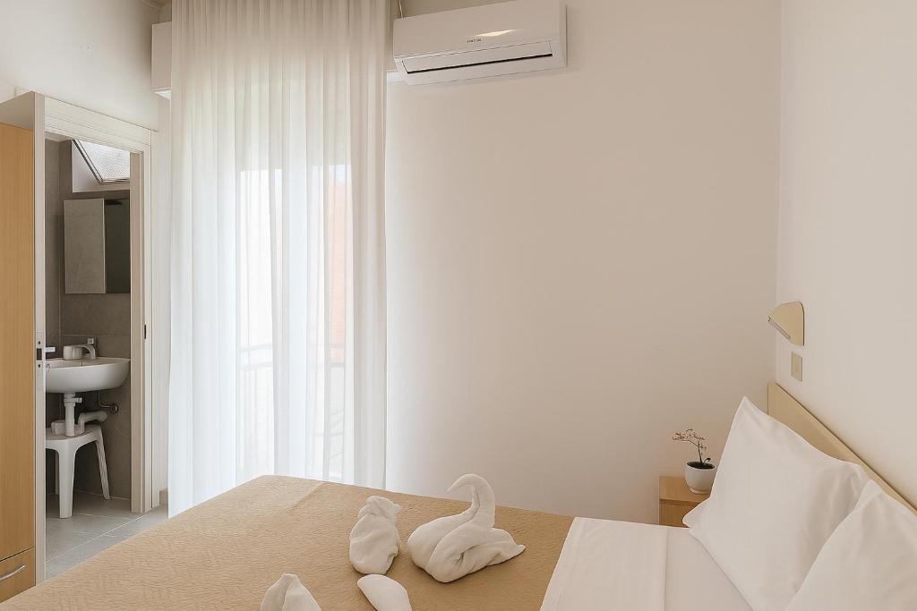 Postel nebo postele na pokoji v ubytování Hotel Baden Baden
