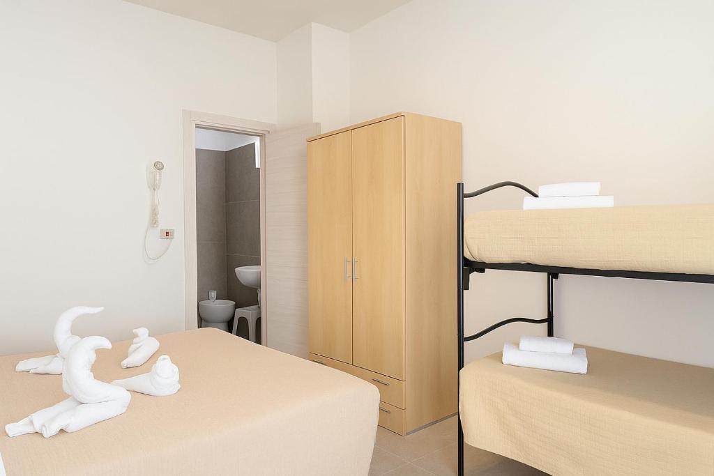 Postel nebo postele na pokoji v ubytování Hotel Baden Baden