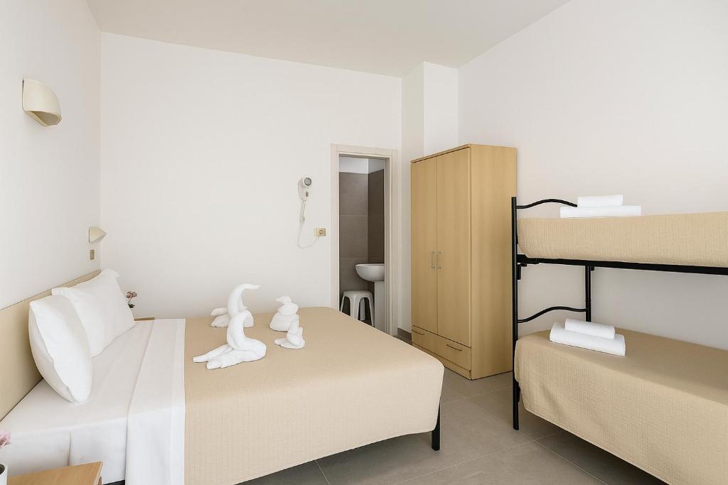 Postel nebo postele na pokoji v ubytování Hotel Baden Baden
