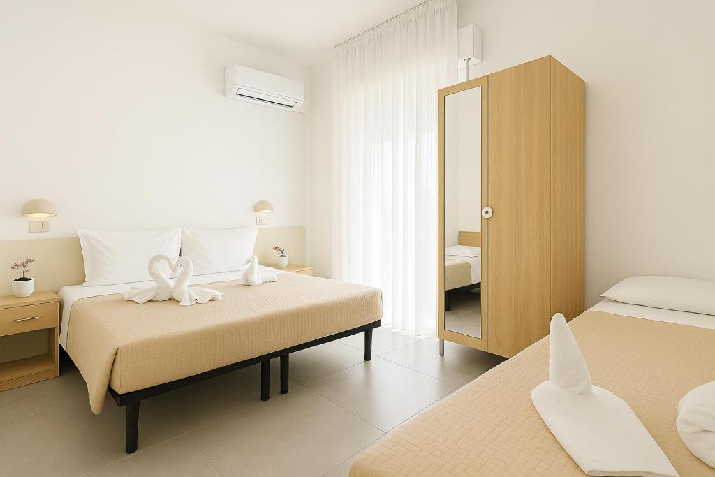 Postel nebo postele na pokoji v ubytování Hotel Baden Baden