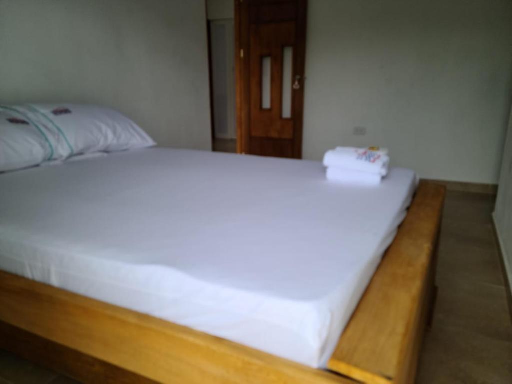 Postel nebo postele na pokoji v ubytování Olamar Hostal