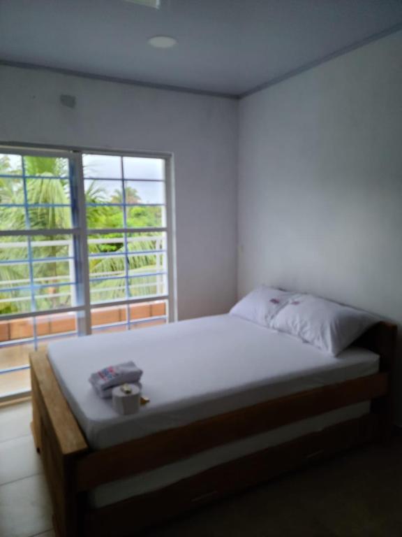 Postel nebo postele na pokoji v ubytování Olamar Hostal