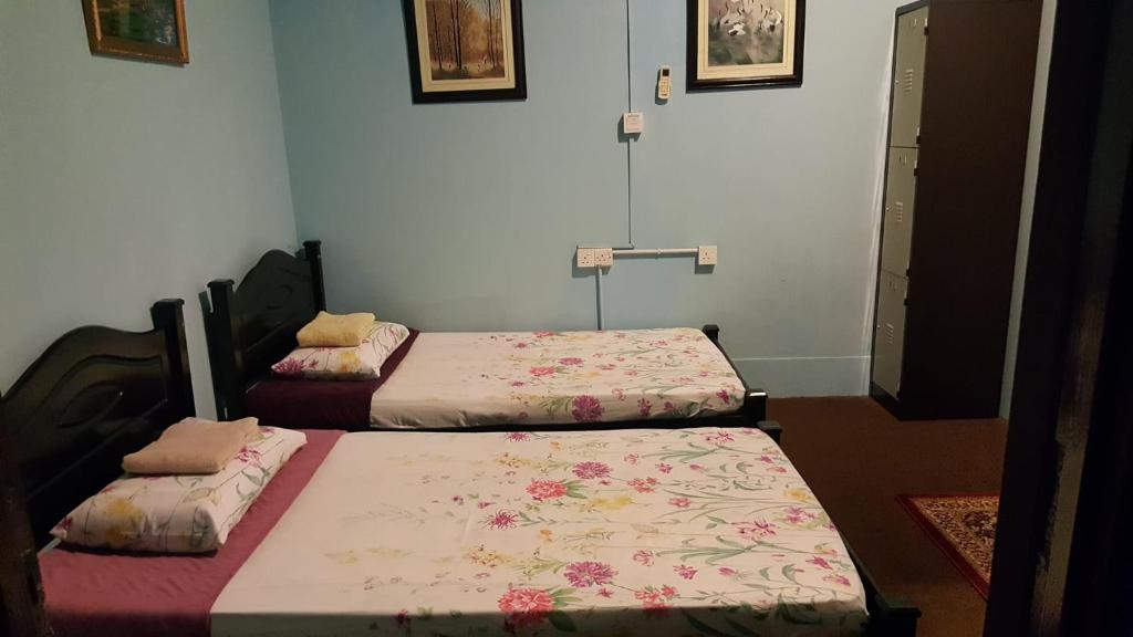 Postel nebo postele na pokoji v ubytování Marco Polo Guest House