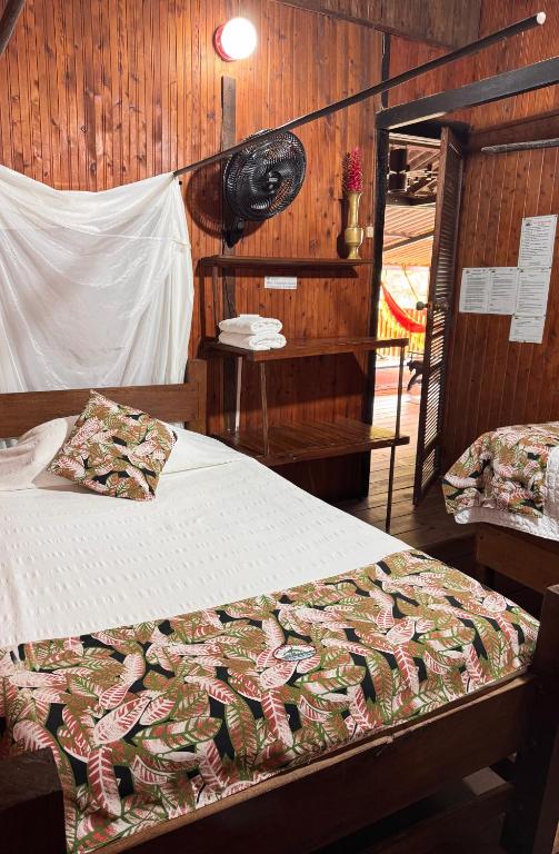 Postel nebo postele na pokoji v ubytování Posada Turística Rocas De Cabo Marzo