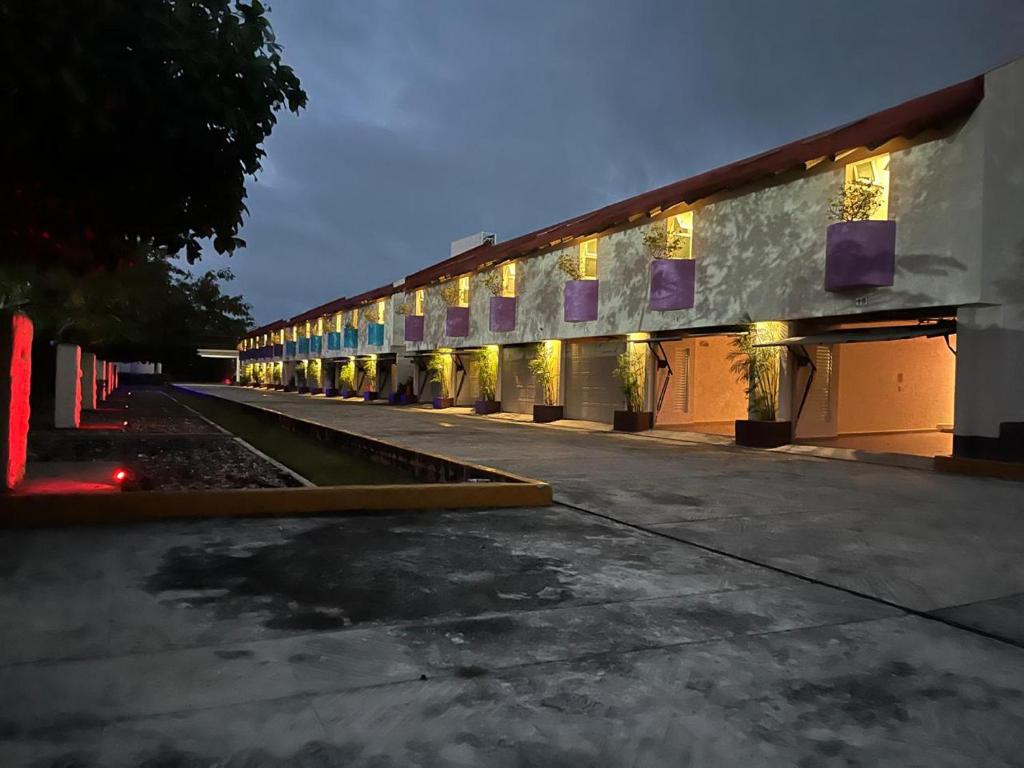 a large building with lights on the side of it at Cerezas in Cancún